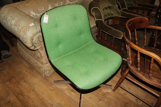 A green upholstered swivel chair